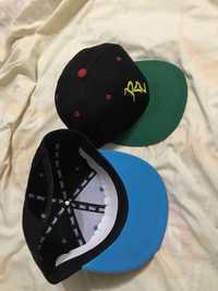 2 SnapBacks revol skateboards company