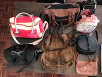 Várias malas, mochilas e carteiras | mulher