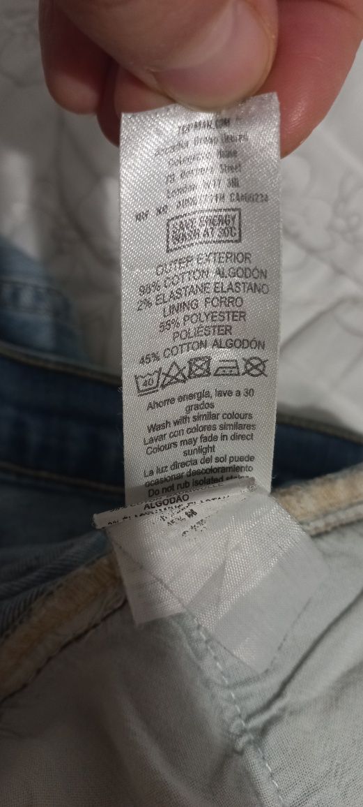 Jasnoniebieskie wytarte damskie jeansy dżinsy spodnie na guziki L XL