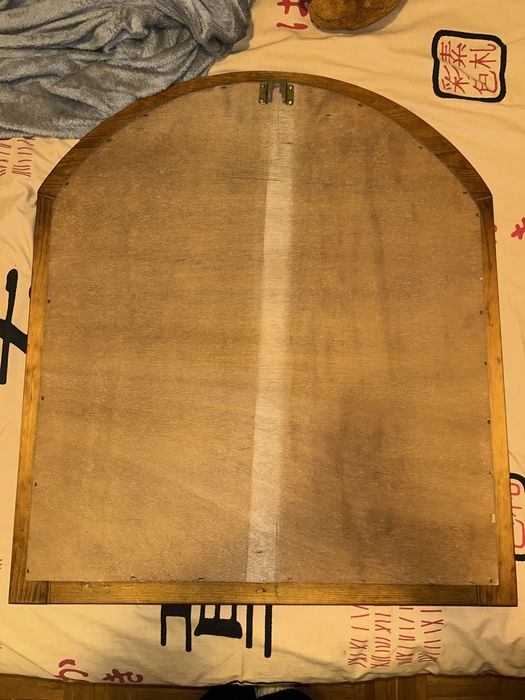 Espelho com rebordo de madeira