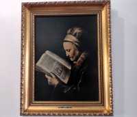 Obraz w złotej ramie - Stara kobieta czytająca lekcjonarz