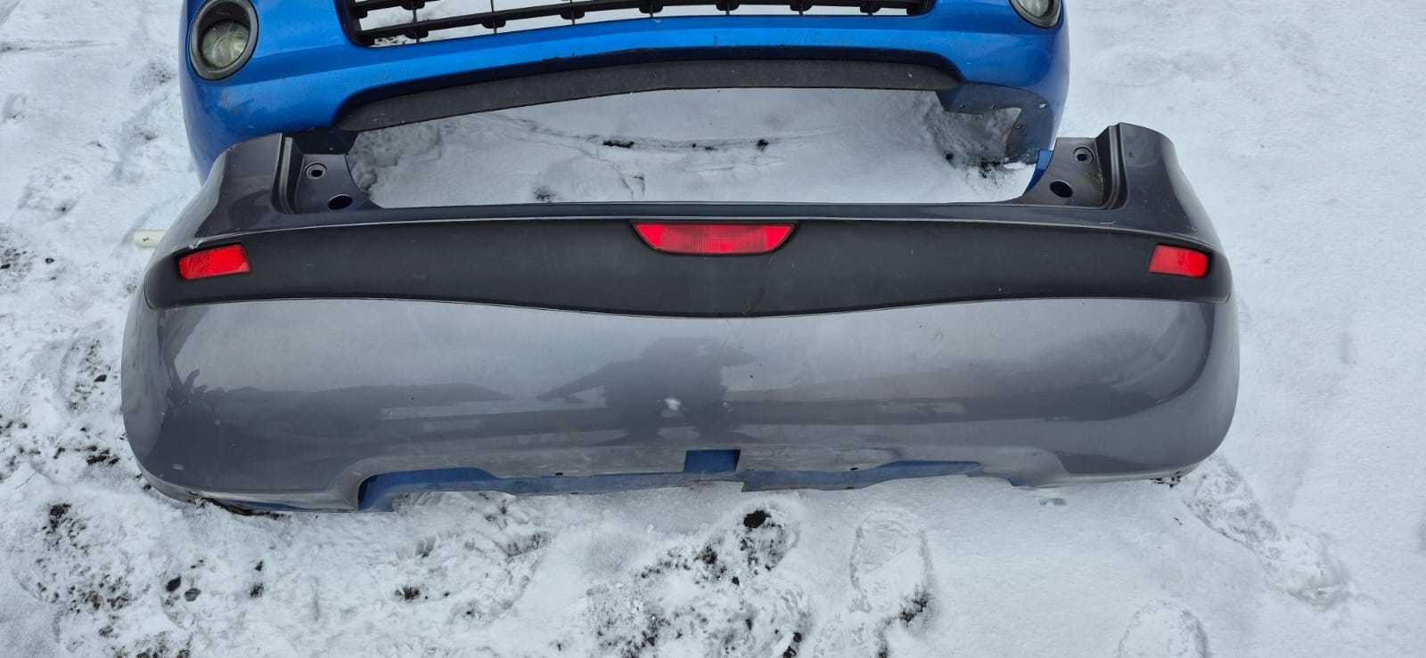 Бампер задній Nissan Note 2006-2013