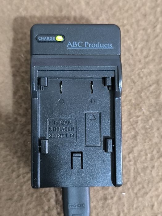 Carregador de bateria p/ câmaras fotográficas