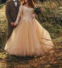 Piękna suknia ślubna z welonem i kołem
