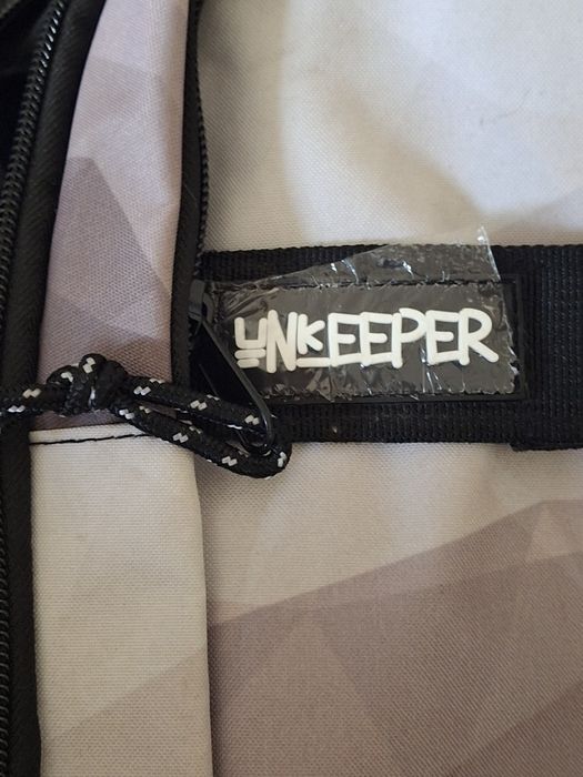 Mochila Unkeeper tons cinza e preto nova rapaz