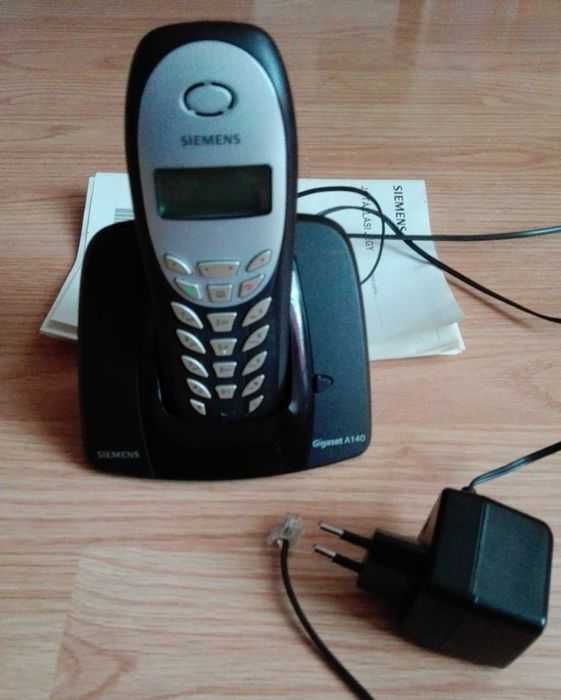 Telefon stacjonarny Siemens z ładowarką i instrukcją