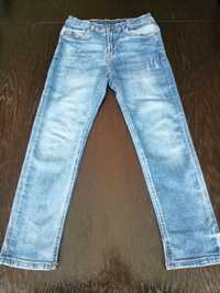 Młodzieżowe spodnie jeansy z przetarciami Reserved r. 158