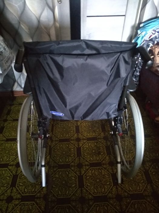 Инвалидная коляска.