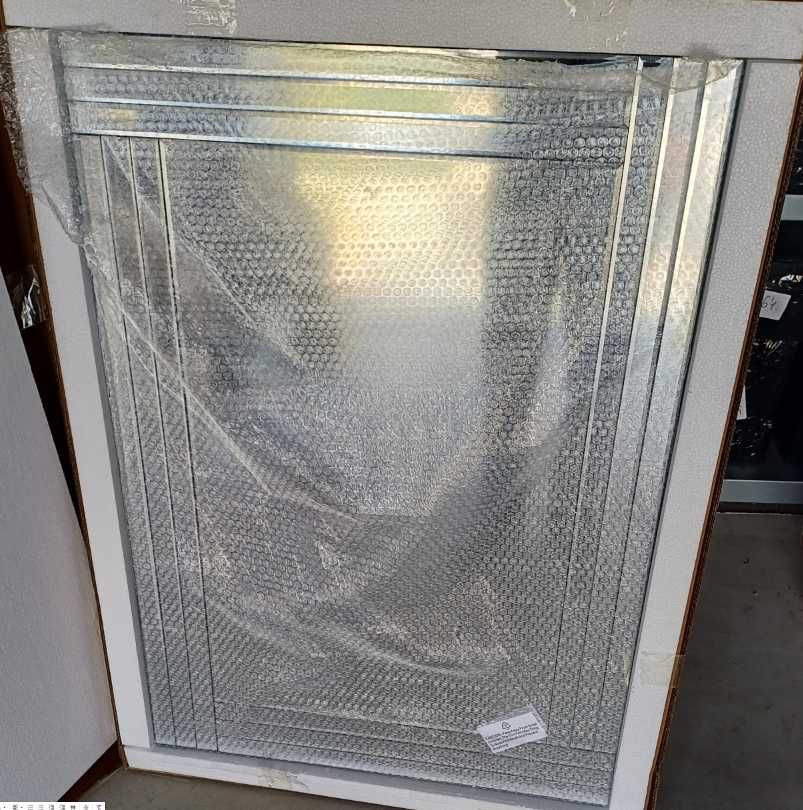 Nowoczesne lustro ścienna fazowane 70x100 cm prostokąt z mini defektem