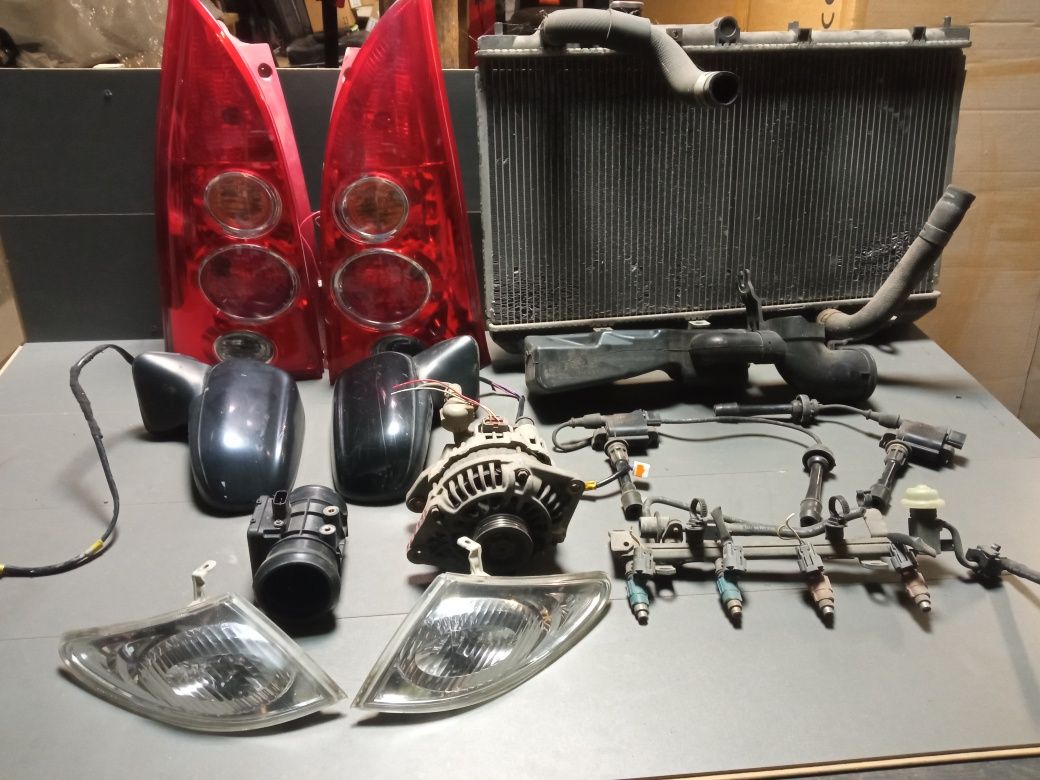 Mazda Premacy 1.8 alternator chłodnica lampy cewka roleta kierunki