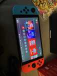 Nintendo Switch OLED + 2 gry + pad i karta pamieci