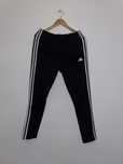 Damskie spodnie sportowe Adidas rozpinane po bokach