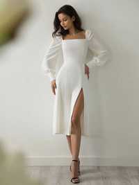 Біла сукня довжини міді