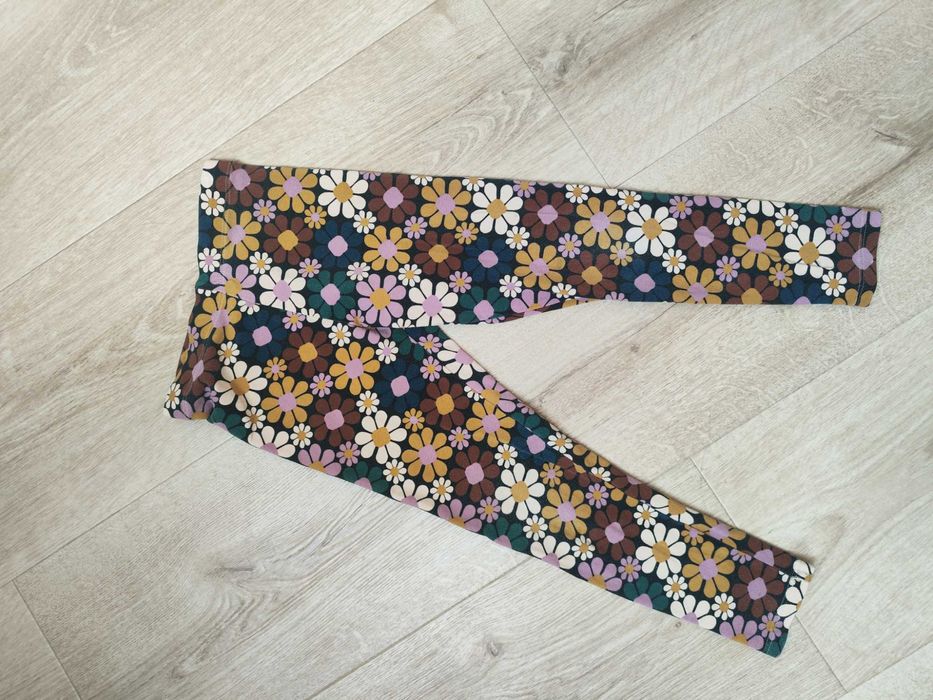 Next legginsy jesienne 128 kwiaty rude zielone długie elastyczne