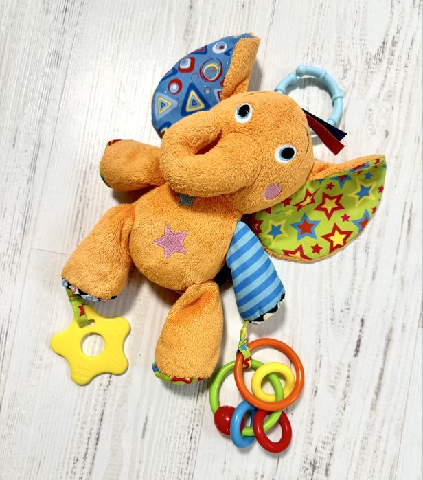 Іграшки для немовлят: спіральки, жираф, слоник, змійки.