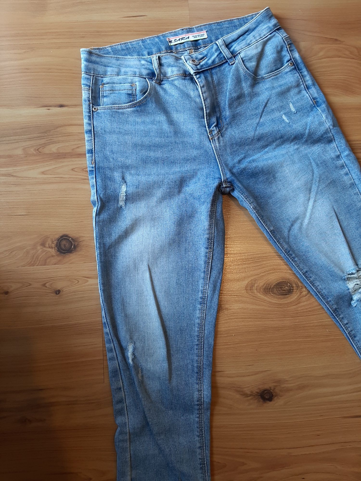 Damskie spodnie jeans S/M z dziurami