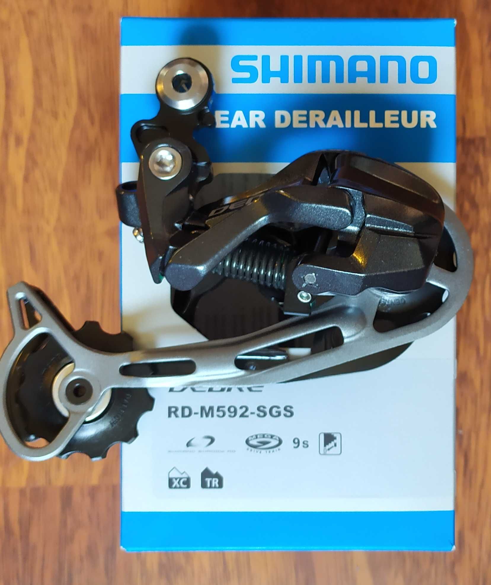 Задній перемикач Shimano Deore; SLX;(ХТ) 7--12 швидкостей