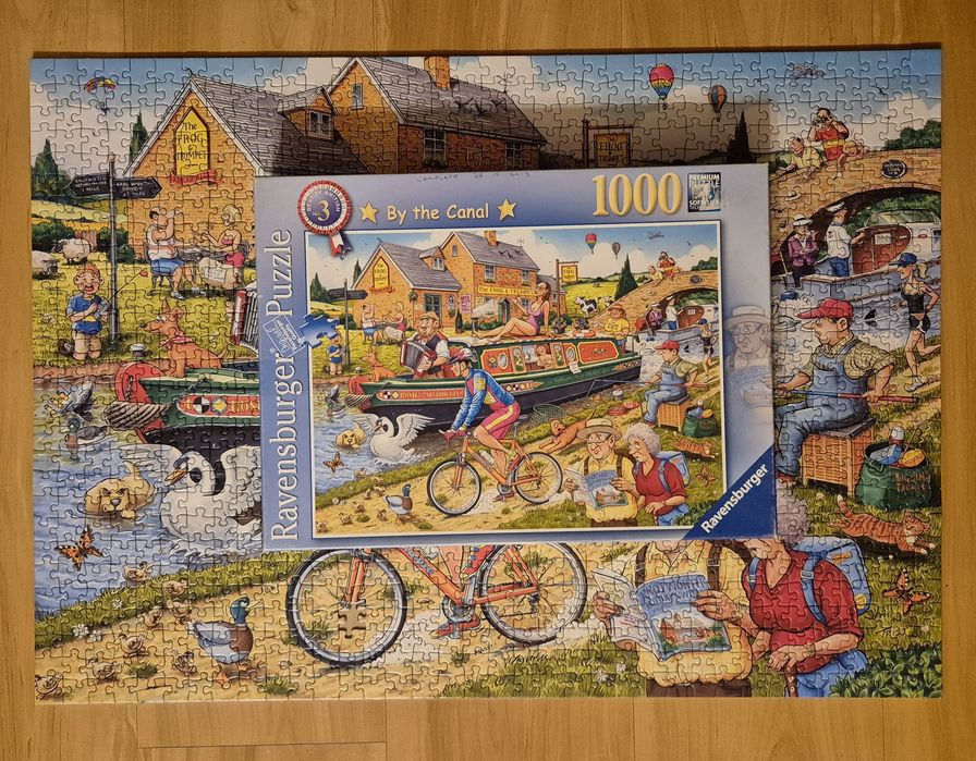 Puzzle Ravensburger 1000 - By The Canal (-1)