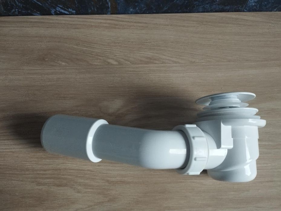 Nowy syfon do wanny firmy Cersanit z korkiem klik