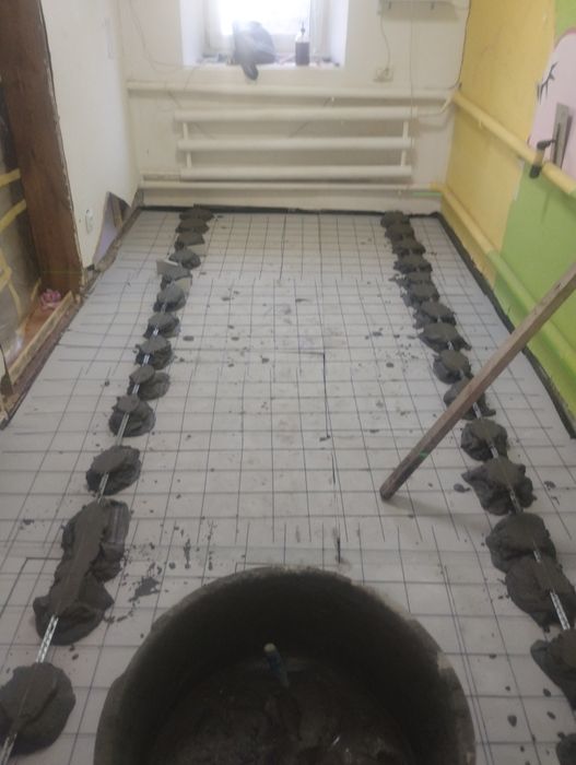 Стяжка пола под  кафель и ламинат