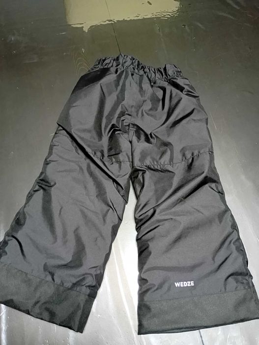 Calcas da neve criança