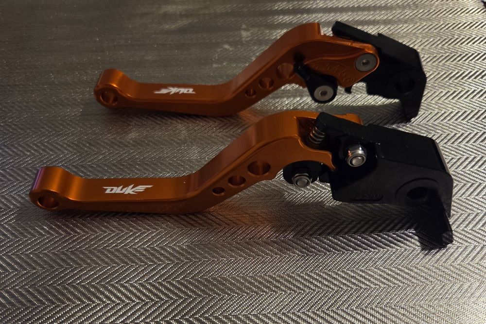 Krótkie klamki manetki 22 mm pomarańczowe