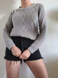 Szary sweter oversize warkocze KappAhl