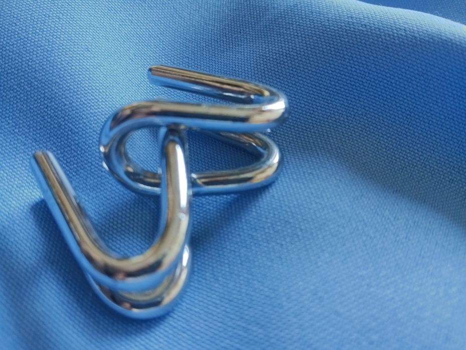 Quebra cabeça  de metal