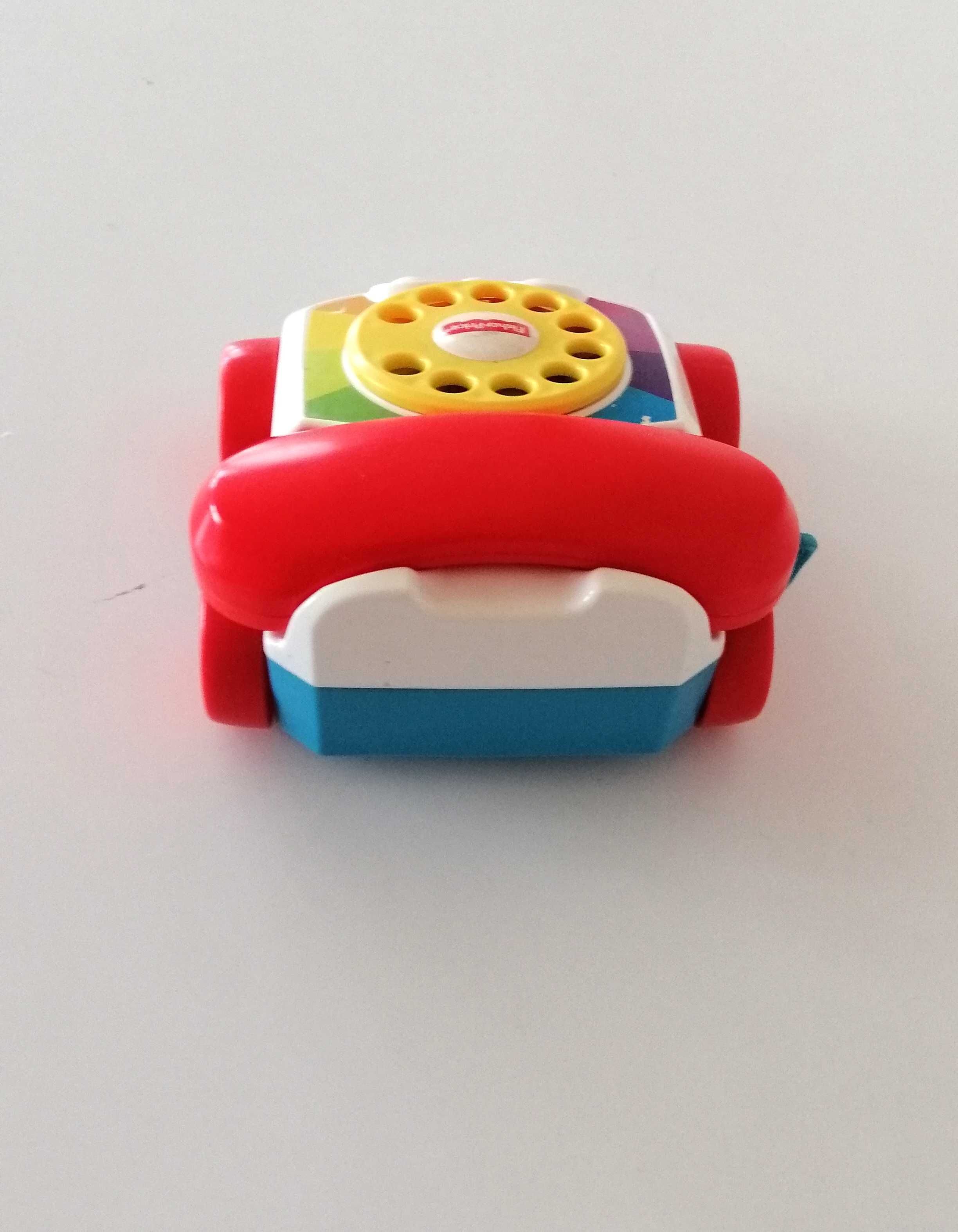 telefonik samochodzik fisher-price ze słuchawką pojazd na korbkę