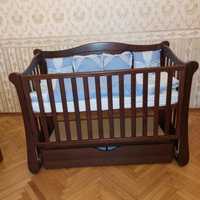 Ліжечко - маятник для новонароджених колір горіх фірми Верес + матрас