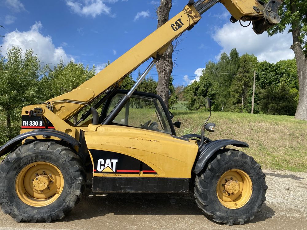 Cat TH 330 spr z Francji  7m 2004r