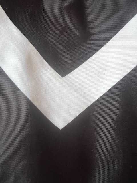 Купальник чорного кольору з білими вставками. Новий.