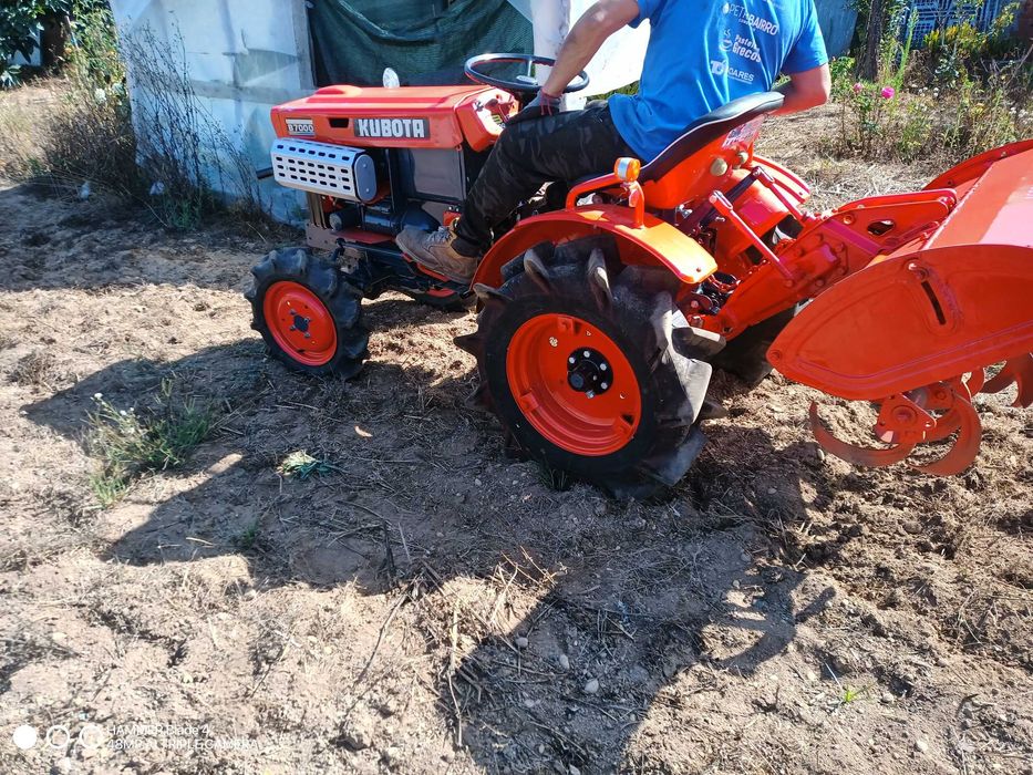 trator kubota com frese