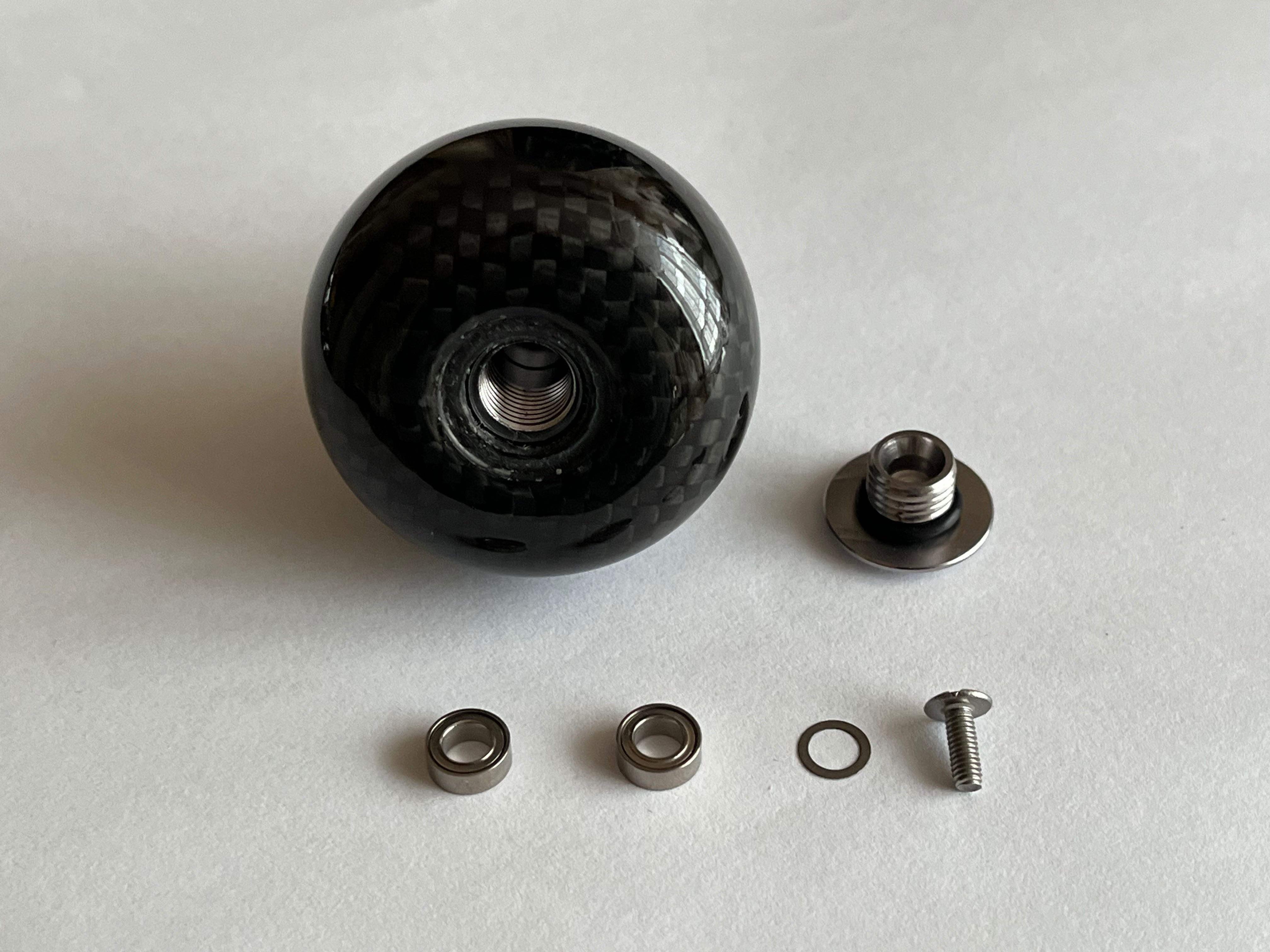 Knob tuningowy z włókna węglowego do kołowrotków Shimano, Daiwa