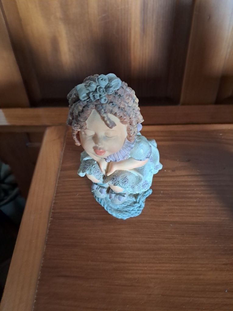 Boneco em porcelana
