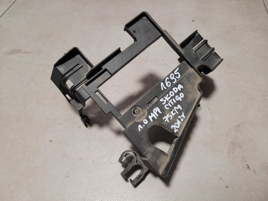 Uchwyt mocowanie skrzynki bezpieczników Skoda Citigo 1S0.915.345