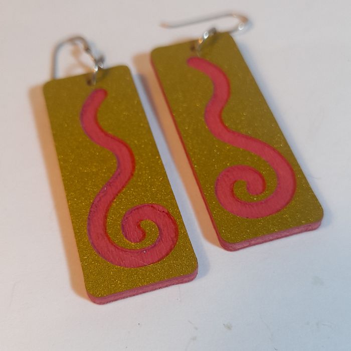 Wooden earrings with spiral design.