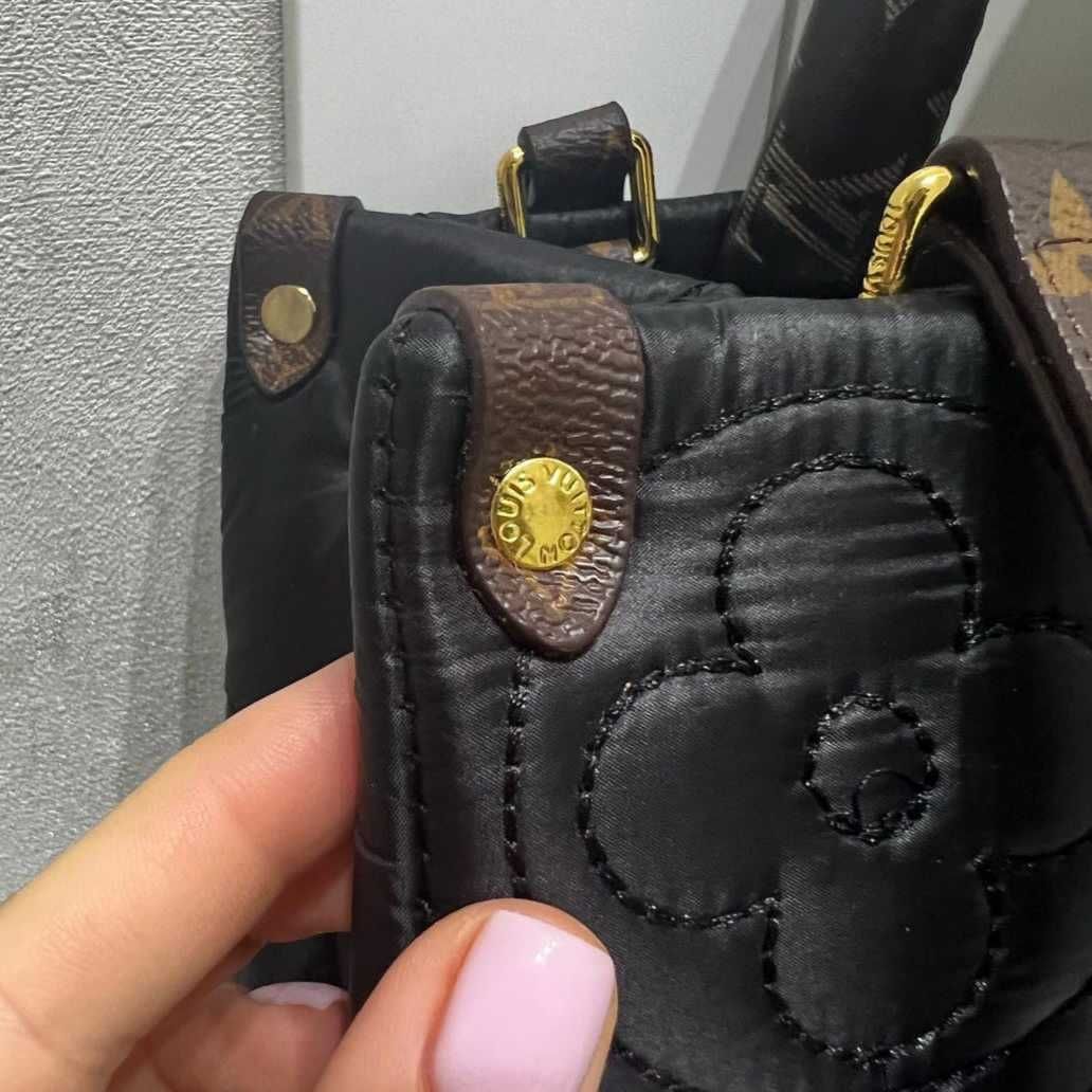 Сумочка Louis Vuitton.