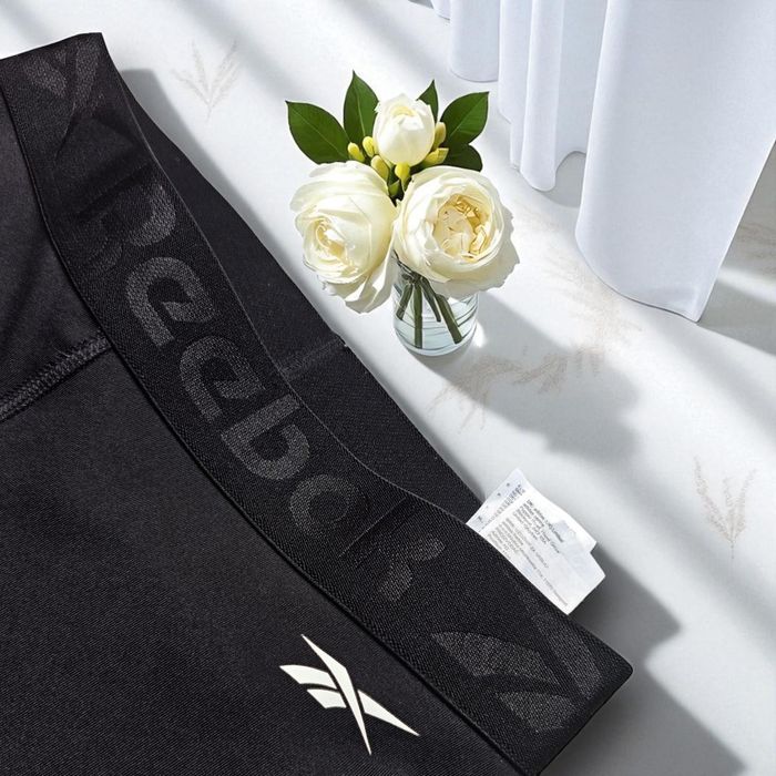 Czarne legginsy damskie Reebok kolarki sportowe rybaczki