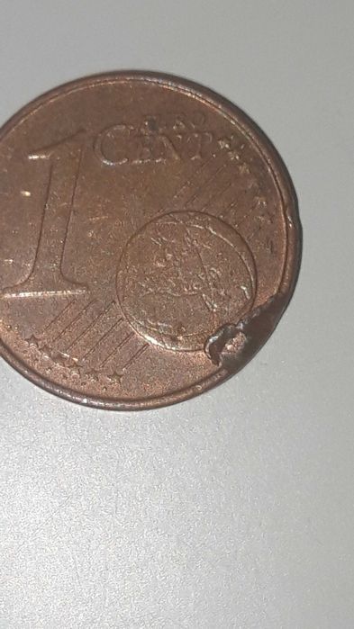 3 moedas de 1 centimo com defeito.