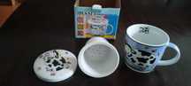 Porcelanowy kubek z porcelanowym zaparzaczem