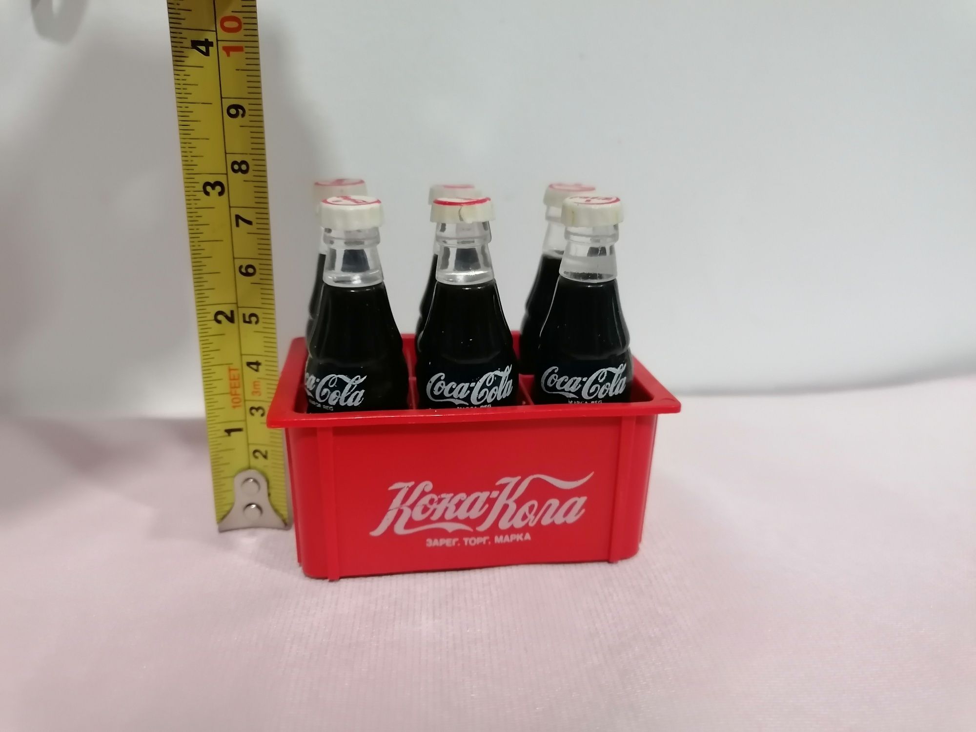 Grade miniatura com 6 garrafinhas em plástico publicidade da Coca-Cola