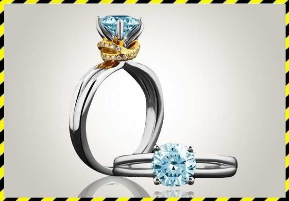 Золотое кольцо в белом золоте с синим / цветным бриллиантом 0,6 ct.