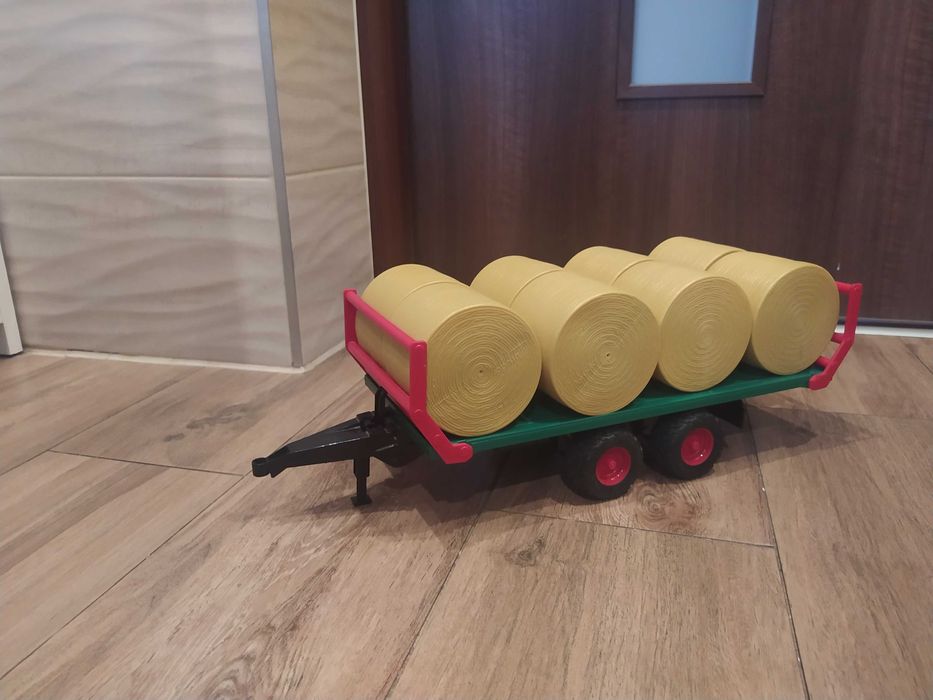 Bruder laweta 2- osiowa, przyczepa do balotów. Stan idealny