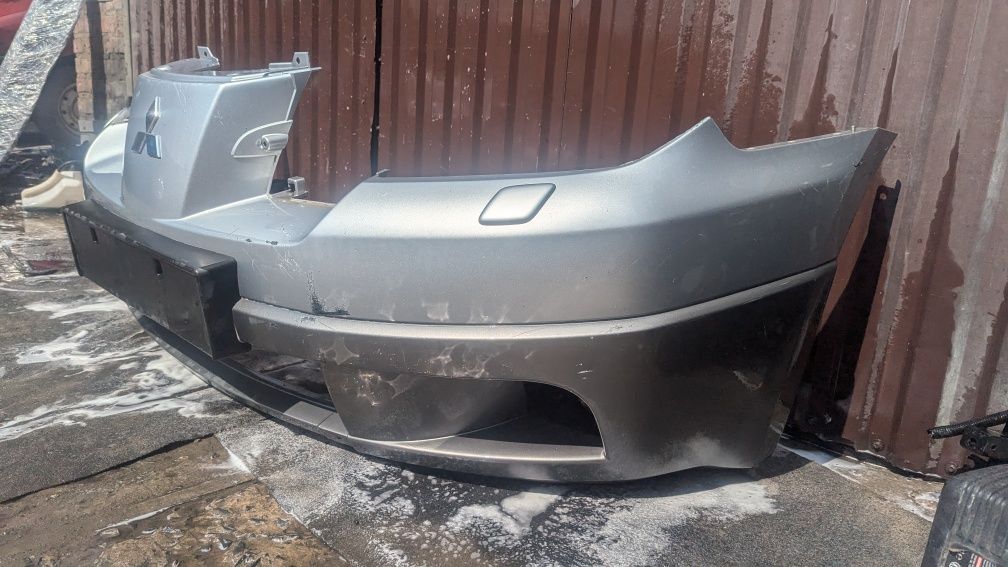 Передній бампер mitsubishi outlander MR971529