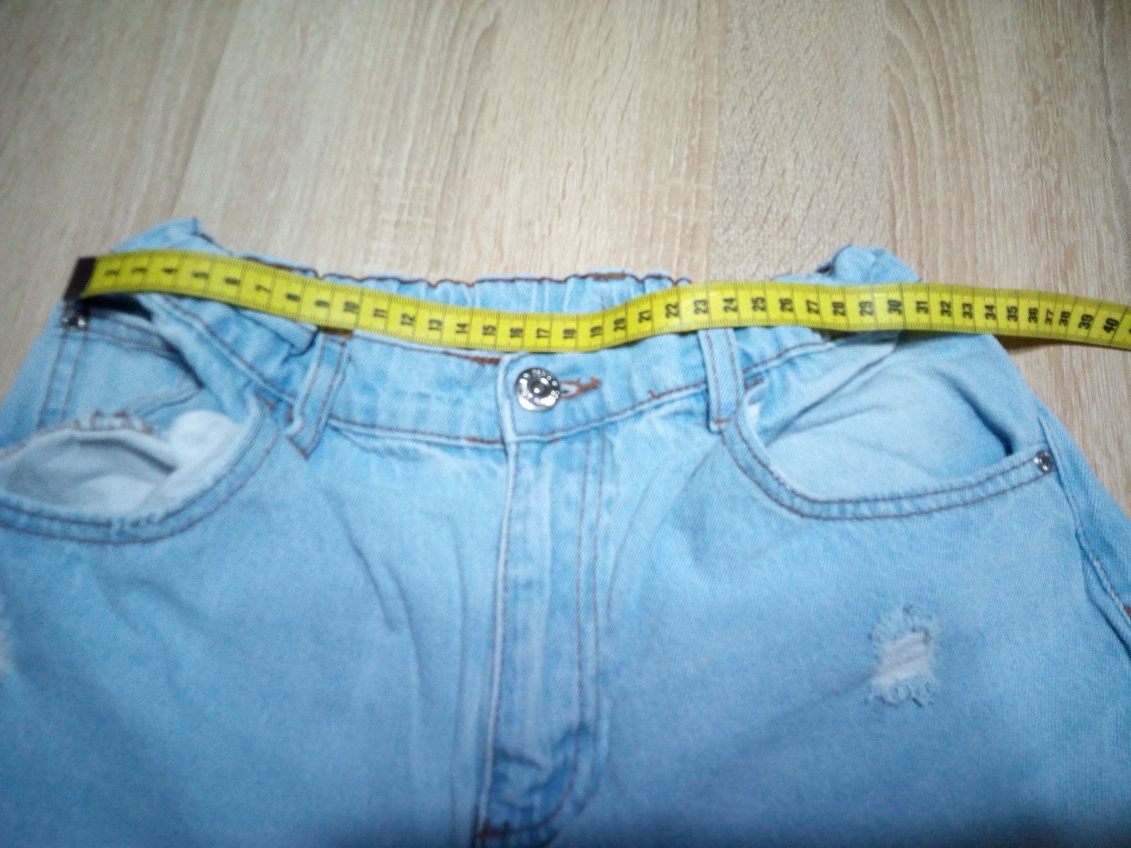 Spodnie jeansowe z dziurami 170cm
