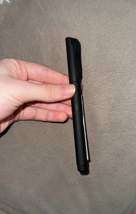 Caneta com tira de papel