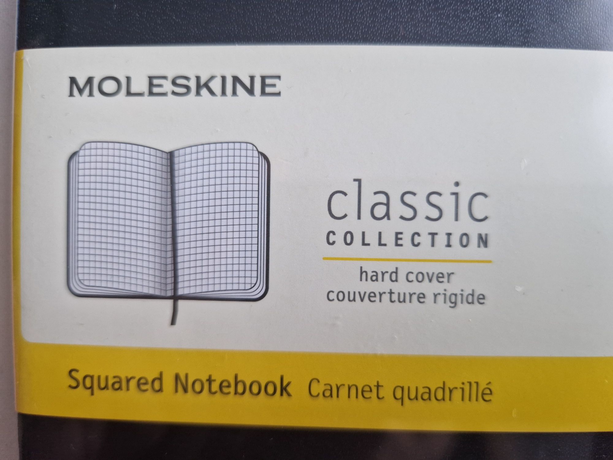 Zafoliowany notes Moleskine Classic L (13x21cm) w kratkę, twarda opraw