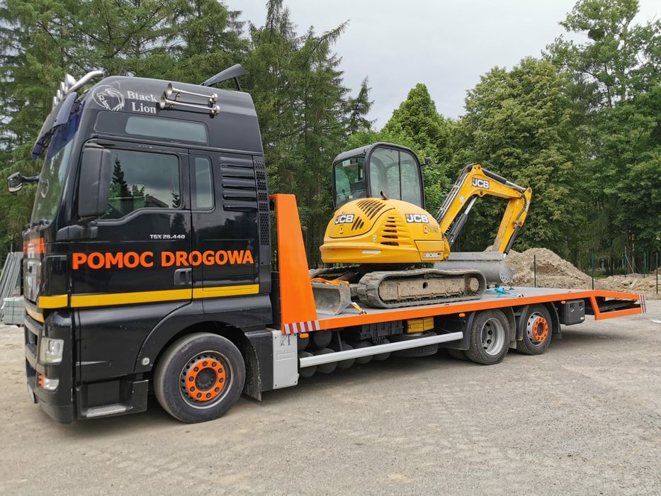 Transport maszyn budowlanych, rolniczych. Pomoc drogowa, laweta wywrot