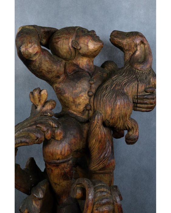 Młodzieniec z psem. Drewno. Rzeźba egzotyczna. XIX wiek.